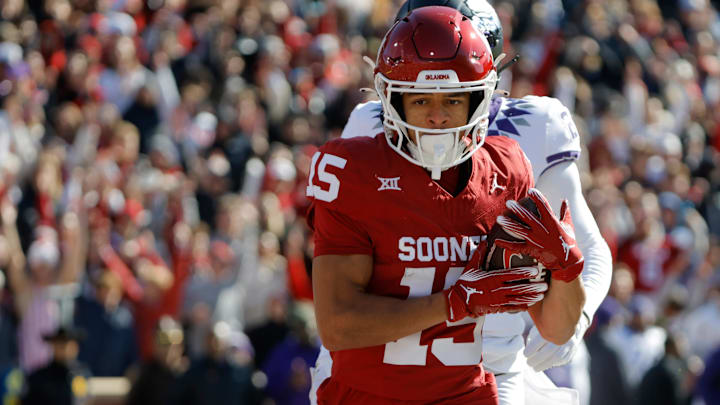 Nov 24, 2023; Norman, Oklahoma, USA; Oklahoma Sooners wide receiver Brenen Thompson (15) catches a touchdown pass against the TCU Horned Frogs at Gaylord Family-Oklahoma Memorial Stadium. Mandatory Credit: Bryan Terry-Imagn Images