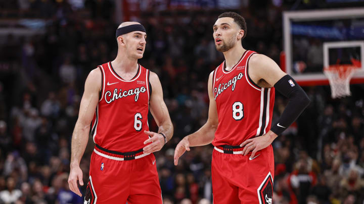 Mar 31, 2022; Chicago, Illinois, USA; Chicago Bulls guard Alex Caruso (6) talks with guard Zach LaVine (8) during overtime of an NBA game against the LA Clippers at United Center. 