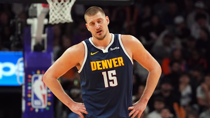 Dec 25, 2024; Phoenix, Arizona, USA; Denver Nuggets center Nikola Jokic (15) reacts against the Phoenix Suns during the second half at Footprint Center. Mandatory Credit: Joe Camporeale-Imagn Images