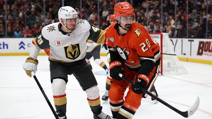 Feb 1, 2026; Anaheim, California, USA;  Anaheim Ducks left wing Chris Kreider (20) fights for the puck against Vegas Golden Knights left wing Ivan Barbashev (49) during the second period at Honda Center. Mandatory Credit: Kiyoshi Mio-Imagn Images