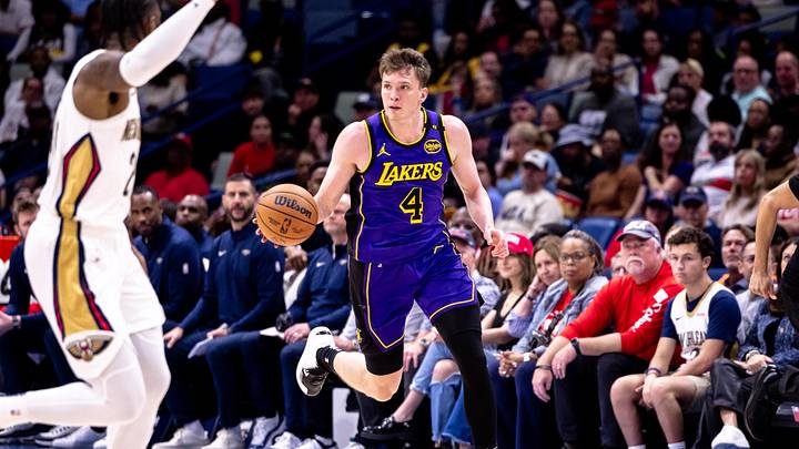 Nov 16, 2024; New Orleans, Louisiana, USA; Los Angeles Lakers guard Dalton Knecht (4) brings the ball up court against the New Orleans Pelicans during the first half at Smoothie King Center. Mandatory Credit: Stephen Lew-Imagn Images