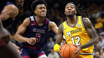 Missouri Tigers guard Sebastian Mack (12) drives in for a bucket, in a game versus the South Carolina State Bulldogs this season.