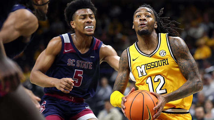 Missouri Tigers guard Sebastian Mack (12) drives in for a bucket, in a game versus the South Carolina State Bulldogs this season.