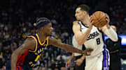 Mar 13, 2025; San Francisco, California, USA; Sacramento Kings guard Zach LaVine (8) looks to pass around Golden State Warriors forward Jimmy Butler III (10) during the second quarter at Chase Center. Mandatory Credit: D. Ross Cameron-Imagn Images