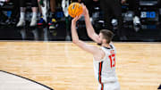 Mar 13, 2025; Indianapolis, IN, USA; Illinois Fighting Illini center Tomislav Ivisic (13) shoots the ball in the first half against the Iowa Hawkeyes at Gainbridge Fieldhouse. Mandatory Credit: Trevor Ruszkowski-Imagn Images