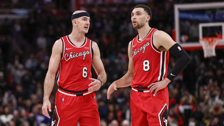 Mar 31, 2022; Chicago, Illinois, USA; Chicago Bulls guard Alex Caruso (6) talks with guard Zach LaVine (8) during overtime of an NBA game against the LA Clippers at United Center. Mandatory Credit: Kamil Krzaczynski-USA TODAY Sports