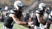 Purdue Boilermakers quarterback Ryan Browne (15) takes a snap 