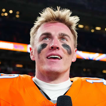 Jan 5, 2025; Denver, Colorado, USA; CBS Sports reporter Tracy Wolfson interviews Denver Broncos quarterback Bo Nix (10) following the win against the Kansas City Chiefs at Empower Field at Mile High. Mandatory Credit: Ron Chenoy-Imagn Images