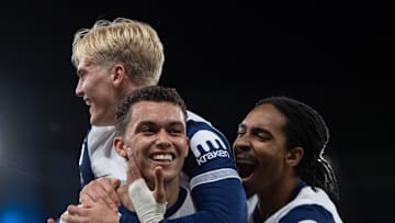 Lucas Bergvall and Djed Spence celebrate with Brennan Johnson after his goal against Manchester City