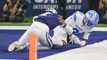 Oct 13, 2024; Arlington, Texas, USA;  Detroit Lions wide receiver Jameson Williams (9) catches a touchdown pass past Dallas Cowboys cornerback Trevon Diggs (7) during the second half at AT&T Stadium. Mandatory Credit: Kevin Jairaj-Imagn Images
