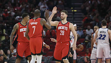 Nov 16, 2025; Houston, Texas, USA; Houston Rockets center Alperen Sengun (28) and forward Kevin Durant (7) celebrate after a play during the second quarter against the Orlando Magic at Toyota Center. Mandatory Credit: Troy Taormina-Imagn Images