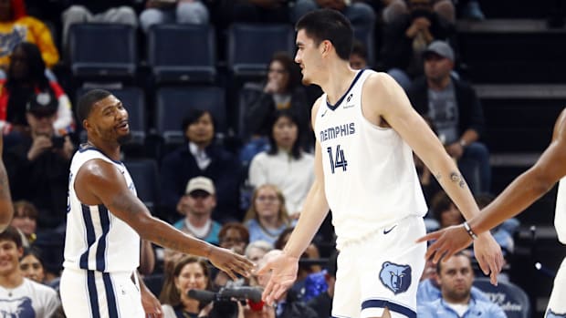 Memphis Grizzlies guard Marcus Smart (36) reacts with center Zach Edey.