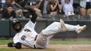 Jul 27, 2024; Chicago, Illinois, USA;  Chicago White Sox outfielder Luis Robert Jr. (88) slides safely into home plate against the Seattle Mariners during the third inning at Guaranteed Rate Field. 