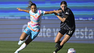 San Diego, California, USA; San Diego Wave FC defender Hanna Lundkvist (6) battles for the ball against Washington Spirit midfielder Paige Metayer (26) during the first half at Snapdragon Stadium. Mandatory Credit: Denis Poroy-USA TODAY Sports