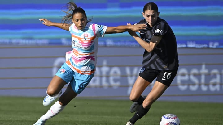 San Diego, California, USA; San Diego Wave FC defender Hanna Lundkvist (6) battles for the ball against Washington Spirit midfielder Paige Metayer (26) during the first half at Snapdragon Stadium. Mandatory Credit: Denis Poroy-USA TODAY Sports