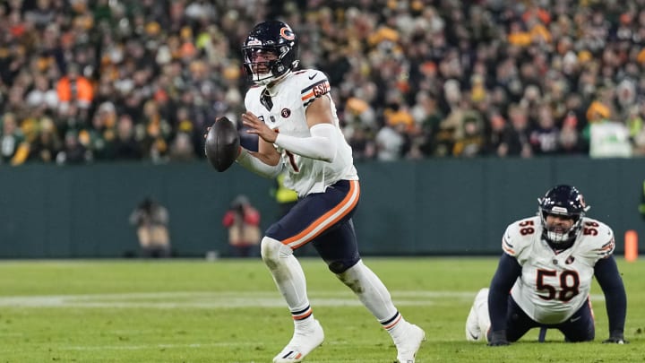 Jan 7, 2024; Green Bay, Wisconsin, USA;  Chicago Bears quarterback Justin Fields (1) looks to throw a pass during the fourth quarter against the Green Bay Packers at Lambeau Field. Mandatory Credit: Jeff Hanisch-USA TODAY Sports