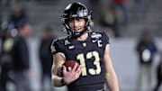 Dec 6, 2024: Army Black Knights quarterback Bryson Daily warms up at Michie Stadium.