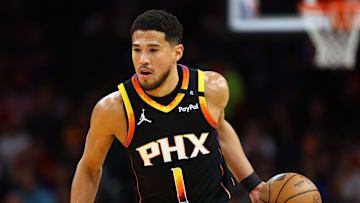 Apr 9, 2025; Phoenix, Arizona, USA; Phoenix Suns guard Devin Booker (1) dribbles the ball against the Oklahoma City Thunder during the first half at Footprint Center. Mandatory Credit: Mark J. Rebilas-Imagn Images