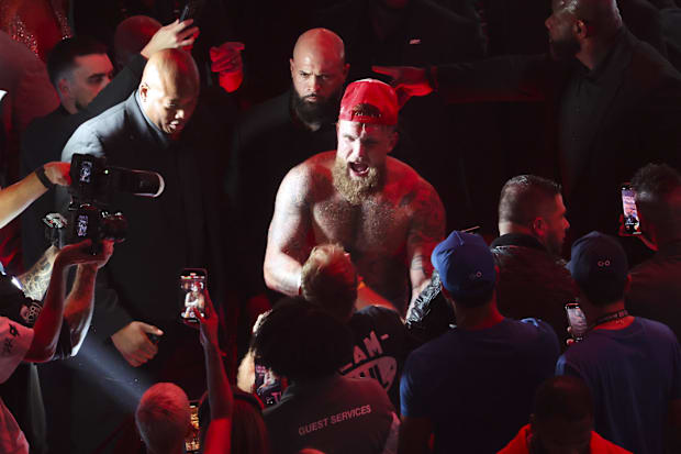 Jake Paul celebrates with fans after his fight against Mike Tyson at AT&T Stadium.