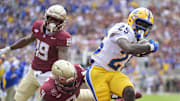 Oct 11, 2025; Tallahassee, Florida, USA; Pittsburgh Panthers running back Ja'Kyrian Turner (25) runs the ball for a touchdown past Florida State Seminoles linebacker Omar Graham Jr. (9) in the first half at Doak S. Campbell Stadium. Mandatory Credit: Melina Myers-Imagn Images