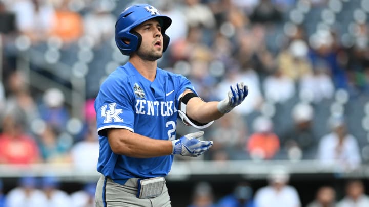 Jun 19, 2024; Omaha, NE, USA;  Kentucky Wildcats left fielder Ryan Waldschmidt (21) takes first base on a walk to start the game against the Florida Gators during the first inning at Charles Schwab Field Omaha. 