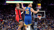 Apr 6, 2025; San Francisco, California, USA; Houston Rockets guard Jalen Green (4) reacts after making a three point basket next to Golden State Warriors guard Stephen Curry (30) in the fourth quarter at the Chase Center. Mandatory Credit: Cary Edmondson-Imagn Images