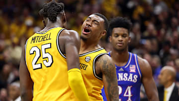 Missouri Tigers players Mark Mitchell (25), and Tony Perkins (12), celebrate during an upset win versus then-No. 1 Kansas.