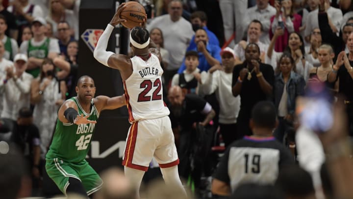 May 29, 2022; Miami, Florida, USA; Miami Heat forward Jimmy Butler (22) attempts a game winning three pointer as Boston Celtics center Al Horford (42) defends in the fourth quarter of game seven of the 2022 eastern conference finals at FTX Arena. Butler missed the shot. Mandatory Credit: Jim Rassol-USA TODAY Sports