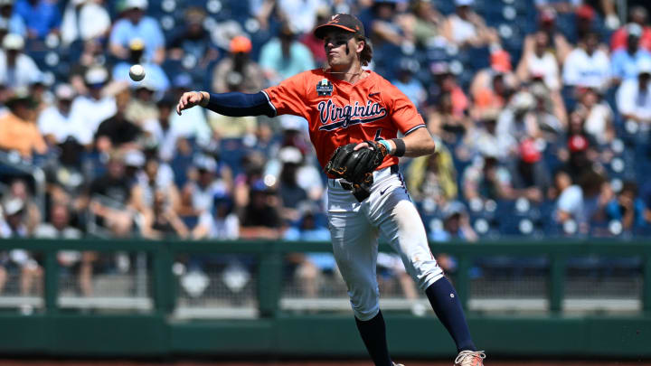 Jun 14, 2024; Omaha, NE, USA;  Virginia Cavaliers shortstop Griff O'Ferrall (6) throws out a runner against the North Carolina Tar Heels at Charles Schwab Filed Omaha. 