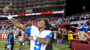 Detroit Lions wide receiver Jameson Williams (9) takes a selfie to celebrate 40-34 win over San Francisco 49ers as he exits the field at Levi's Stadium in Santa Clara, Calif. on Monday, Dec. 30, 2024.