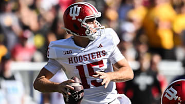 Sep 27, 2025; Iowa City, Iowa, USA; Indiana Hoosiers quarterback Fernando Mendoza (15) throws a pass against the Iowa Hawkeyes during the second quarter at Kinnick Stadium. Mandatory Credit: Jeffrey Becker-Imagn Images