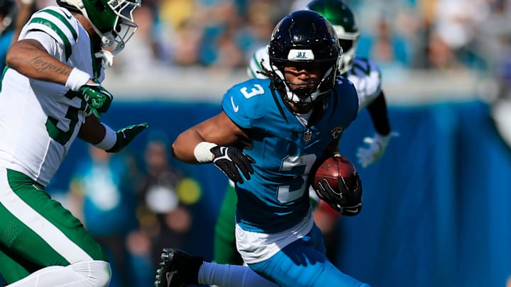 Jacksonville Jaguars wide receiver Jakobi Meyers (3) rushes for yards against New York Jets cornerback Qwan'Tez Stiggers (37) during the first quarter of an NFL football matchup at EverBank Stadium, Sunday, Dec. 14, 2025, in Jacksonville, Fla.