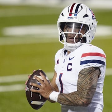 Nov 1, 2025; Boulder, Colorado, USA; Arizona Wildcats quarterback Noah Fifita (1) prepares to pass the ball in second quarter against the Colorado Buffaloes at Folsom Field. Mandatory Credit: Ron Chenoy-Imagn Images