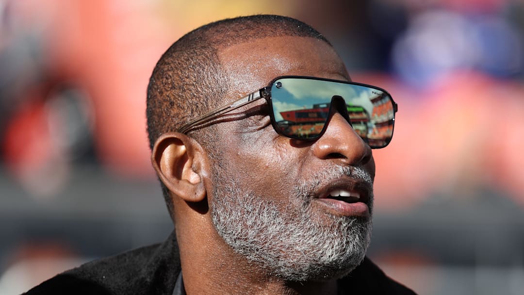 Dec 21, 2025; Cleveland, Ohio, USA;  Legendary  football and baseball player and father of Cleveland Browns quarterback Shedeur Sanders, Deion Sanders on the sidelines prior to a game against the Buffalo Bills at Huntington Bank Field. 