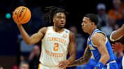 Mar 22, 2025; Lexington, KY, USA; Tennessee Volunteers guard Chaz Lanier (2) handles the ball against UCLA Bruins guard Kobe Johnson (0) during the first half in the second round of the NCAA Tournament at Rupp Arena. Mandatory Credit: Jordan Prather-Imagn Images