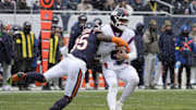 Nov 9, 2025; Chicago, Illinois, USA; Chicago Bears safety C.J. Gardner-Johnson (35) sacks New York Giants quarterback Jaxson Dart (6) during the first half at Soldier Field.  