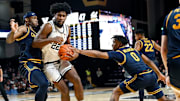 Vanderbilt forward Jaylen Carey (22) goes to the basket between California’s Lee Dort, left, and Jeremiah Wilkinson (0) during an NCAA college basketball game Wednesday, Nov. 13, 2024, in Nashville, Tenn.