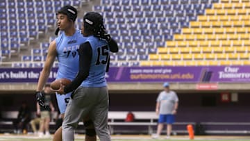 Arena Elite 15U’s Kasen Thomas (9), left, celebrates a teammate’s touchdown during a 7-on-7 football tournament Saturday, April 13, 2024 at the UNI Dome in Cedar Falls, Iowa.