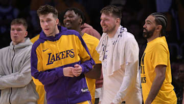 Feb 10, 2025; Los Angeles, California, USA; Los Angeles Lakers guard Dalton Knecht (4), guard Austin Reaves (15) and guard Gabe Vincent (7) on the bench in the second half against the Utah Jazz at Crypto.com Arena. Mandatory Credit: Jayne Kamin-Oncea-Imagn Images