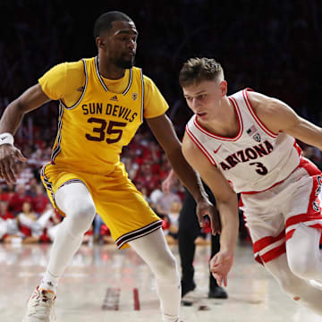 Feb 25, 2023; Tucson, Arizona, USA; Arizona Wildcats guard Pelle Larsson (3) drives to the net against Arizona State Sun Devils guard Devan Cambridge (35) in the second half at McKale Center. Mandatory Credit: Zachary BonDurant-Imagn Images
