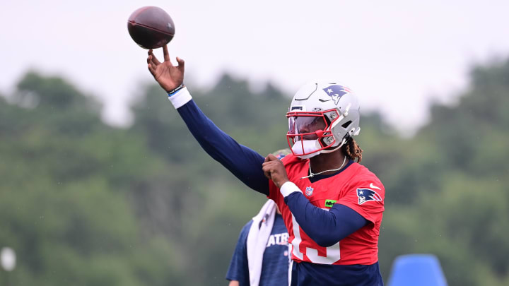 Jul 24, 2024; Foxborough, MA, USA;  New England Patriots quarterback Joe Milton III (19) throws a pass during training camp at Gillette Stadium. Mandatory Credit: Eric Canha-USA TODAY Sports