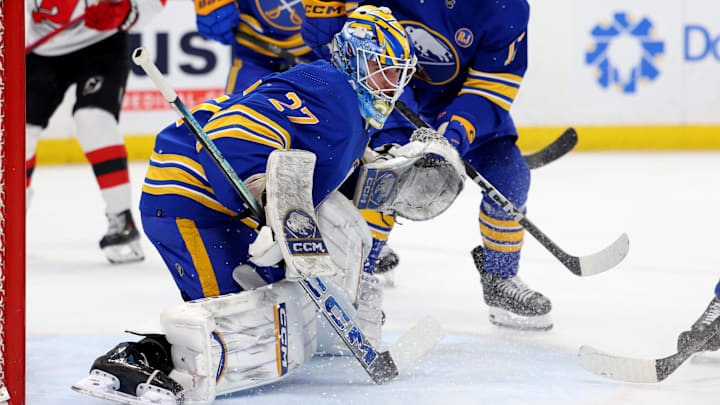 Mar 29, 2024; Buffalo, New York, USA;  Buffalo Sabres goaltender Devon Levi (27) looks to make a save during the first period against the New Jersey Devils at KeyBank Center. Mandatory Credit: Timothy T. Ludwig-Imagn Images