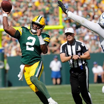 Green Bay Packers quarterback Malik Willis (2) throws a pass against Indianapolis Colts defensive end Dayo Odeyingbo (54) during their football game Sunday, September 15, 2024, at Lambeau Field in Green Bay, Wisconsin.