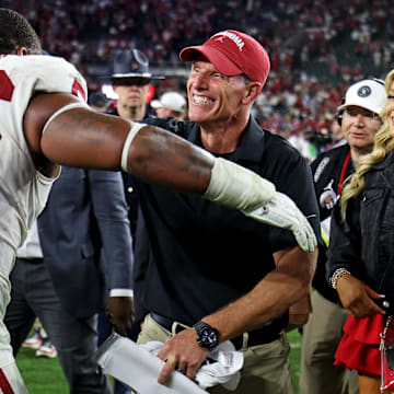Oklahoma Sooners head coach Brent Venables celebrates with defensive lineman Gracen Halton (56) after Oklahoma defeated the Alabama Crimson Tide 23-21 at Saban Field at Bryant-Denny Stadium on Saturday.