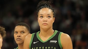 May 21, 2025; Minneapolis, Minnesota, USA; Minnesota Lynx guard Natisha Hiedeman (2), guard Courtney Williams (10) and forward Napheesa Collier (24) watch a free throw in the third quarter against the Dallas Wings at Target Center. Mandatory Credit: Bruce Kluckhohn-Imagn Images