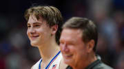 Nov 10, 2023; Lawrence, Kansas, USA; Kansas Jayhawks guard Johnny Furphy (10) and head coach Bill Self react during the second half against the Manhattan Jaspers at Allen Fieldhouse. Mandatory Credit: Jay Biggerstaff-USA TODAY Sports