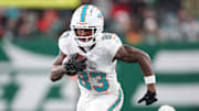 Miami Dolphins wide receiver Malik Washington (83) gains yards after catch during the first half against the New York Jets at MetLife Stadium. 