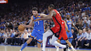 Oct 21, 2025; Oklahoma City, Oklahoma, USA; Oklahoma City Thunder center Chet Holmgren (7) moves the ball down the court as Houston Rockets forward Kevin Durant (7) defends during the first half at Paycom Center. Mandatory Credit: Alonzo Adams-Imagn Images