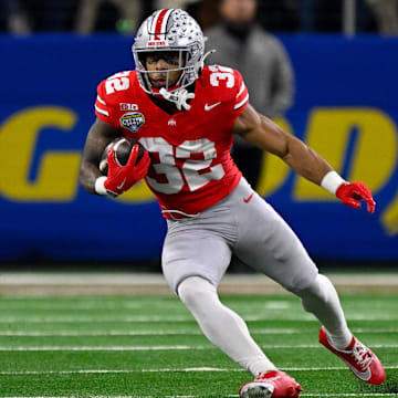 Jan 10, 2025; Arlington, TX, USA; Ohio State Buckeyes running back TreVeyon Henderson (32) in action during the game between the Texas Longhorns and the Ohio State Buckeyes at AT&T Stadium. 
