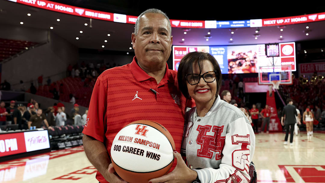 Houston Cougars head coach Kelvin Sampson and his wife Karen Sampson pose with tonight a basketball commemorating his 800th win. The Cougars beat the Lehigh Mountain Hawks at Fertitta Center. 